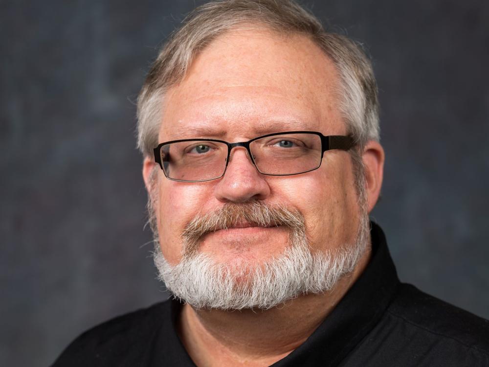 A portrait of Penn State Behrend faculty member George Looney