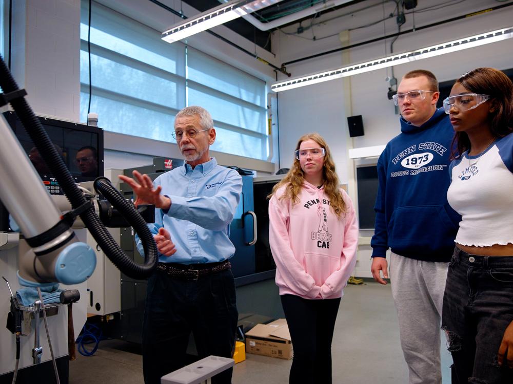 Students learning about equipment in the MILL