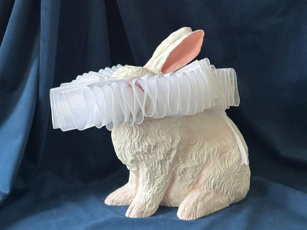A sculptural rabbit with a white collar over its eyes by artist Darla Jackson