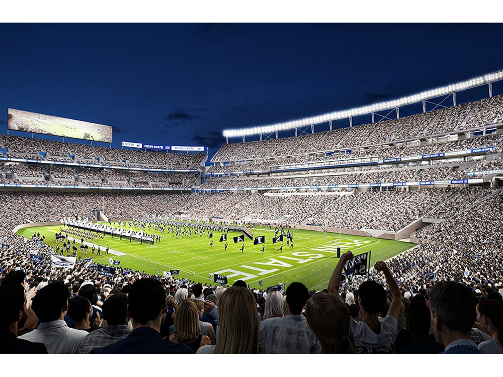 A full stadium watches a half-time show at a football game