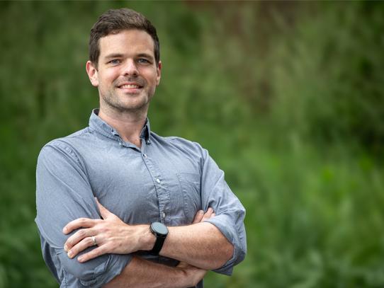 A photo of Jon MacArthur posing for a portrait.