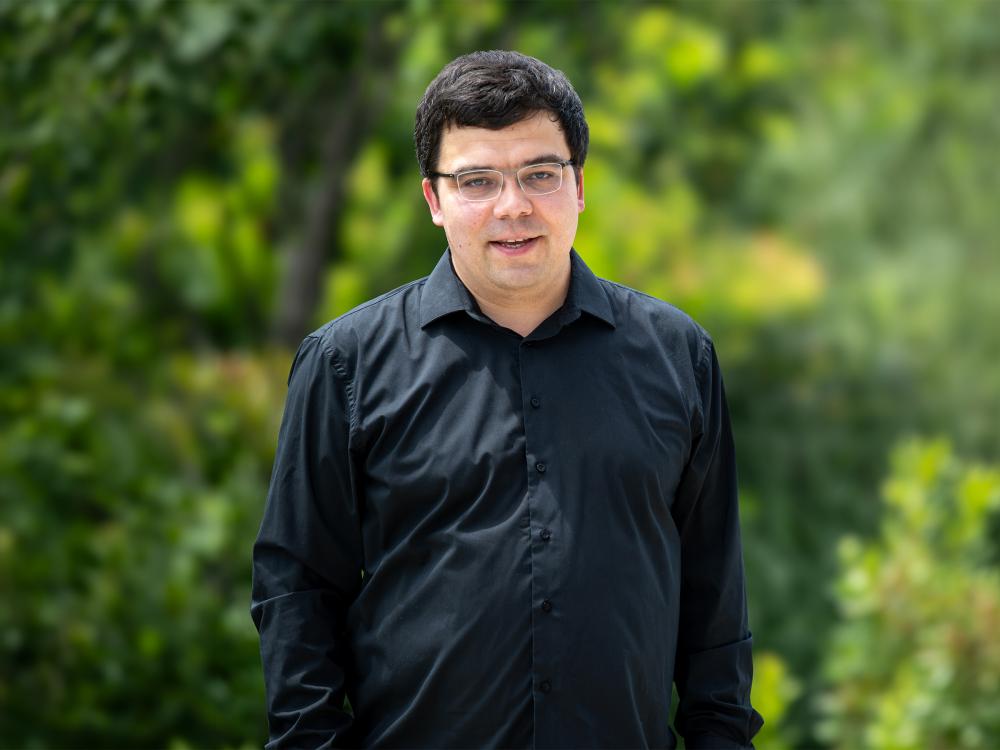 A portrait of Ruslan Nikolaev.