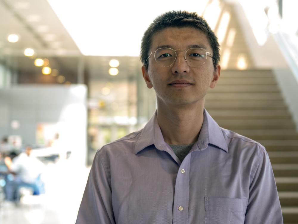 A professor of engineering science and mechanics and affiliated faculty member in four additional Penn State engineering departments poses for a photo outdoors.