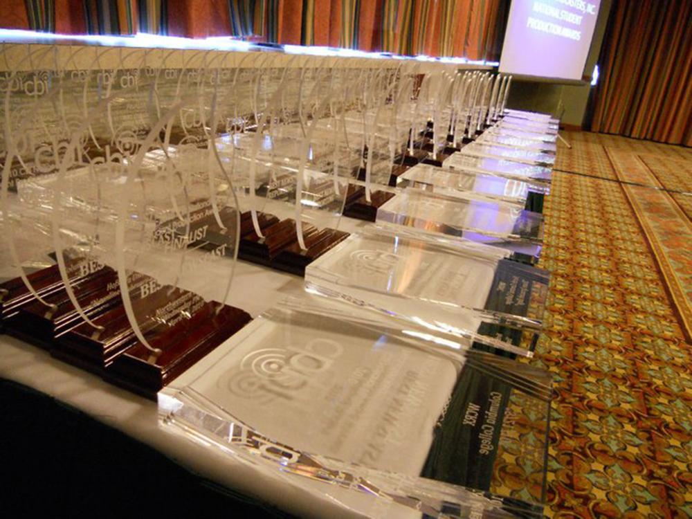 A collection of crystal awards on a table