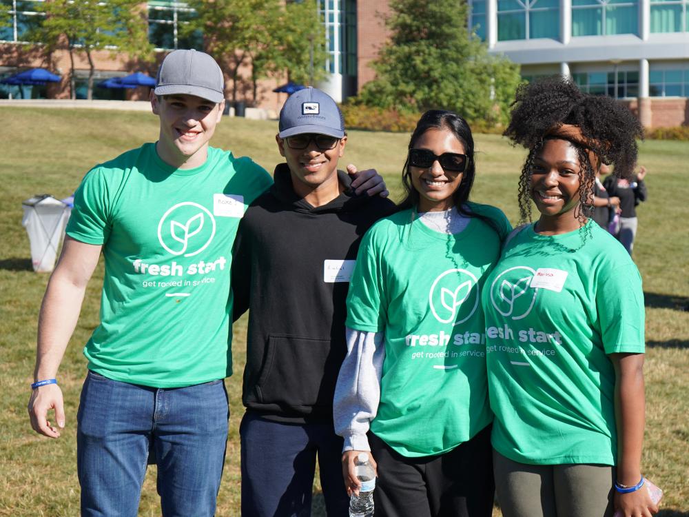 Four student smile outside during FreshStart