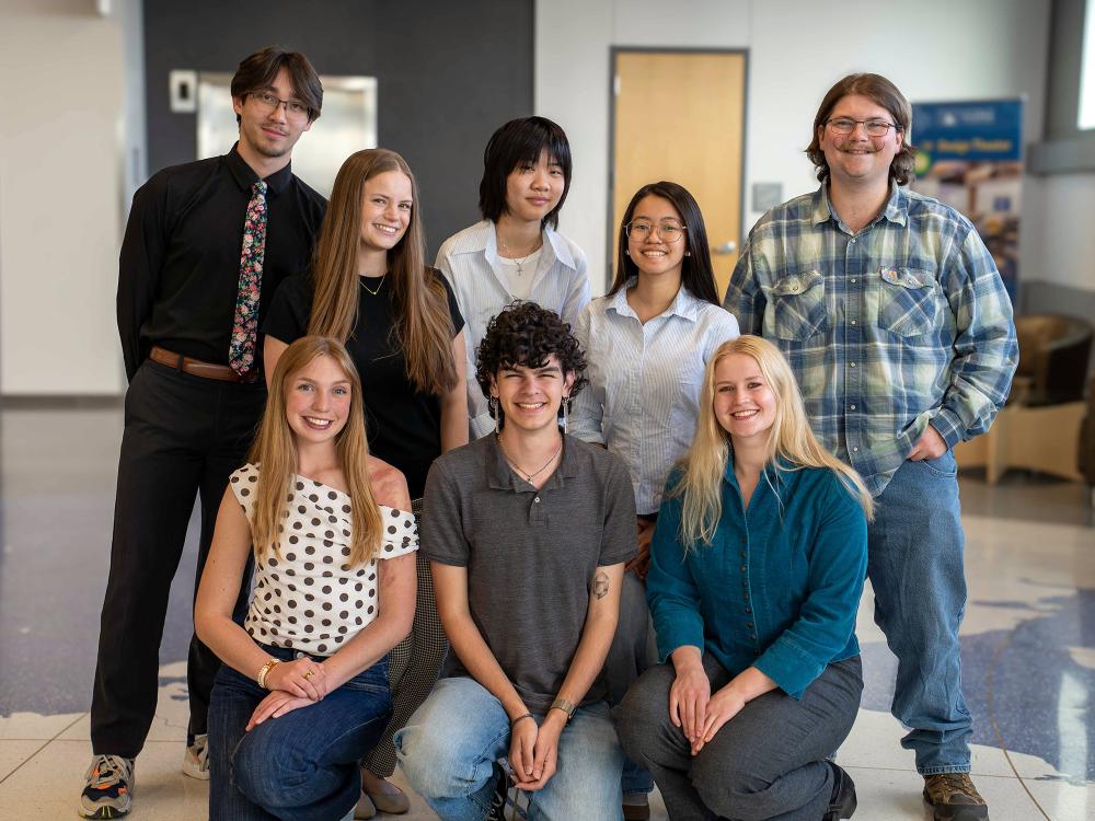 Penn State student Declan Goldhawk is surrounded by other interns at the Alaska Center for Energy and Power in Fairbanks
