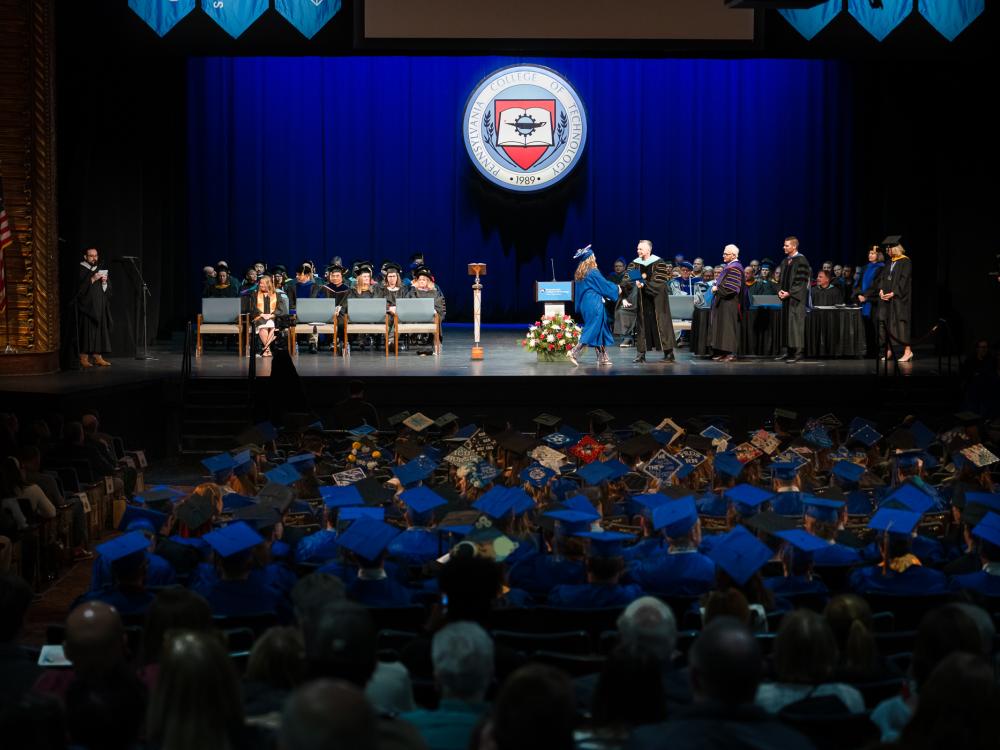 An image of the stage at a commencement ceremony