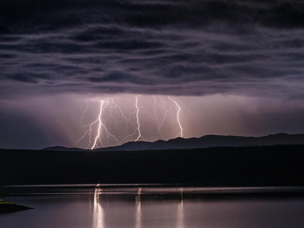 Lightning during thunderstorm over water