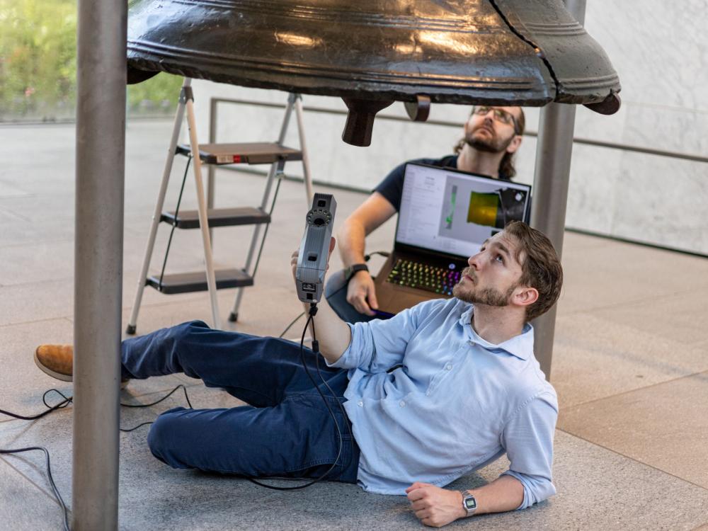 Penn State Behrend alumnus Remington Orange scans the Liberty Bell during a two-day research trip in June.