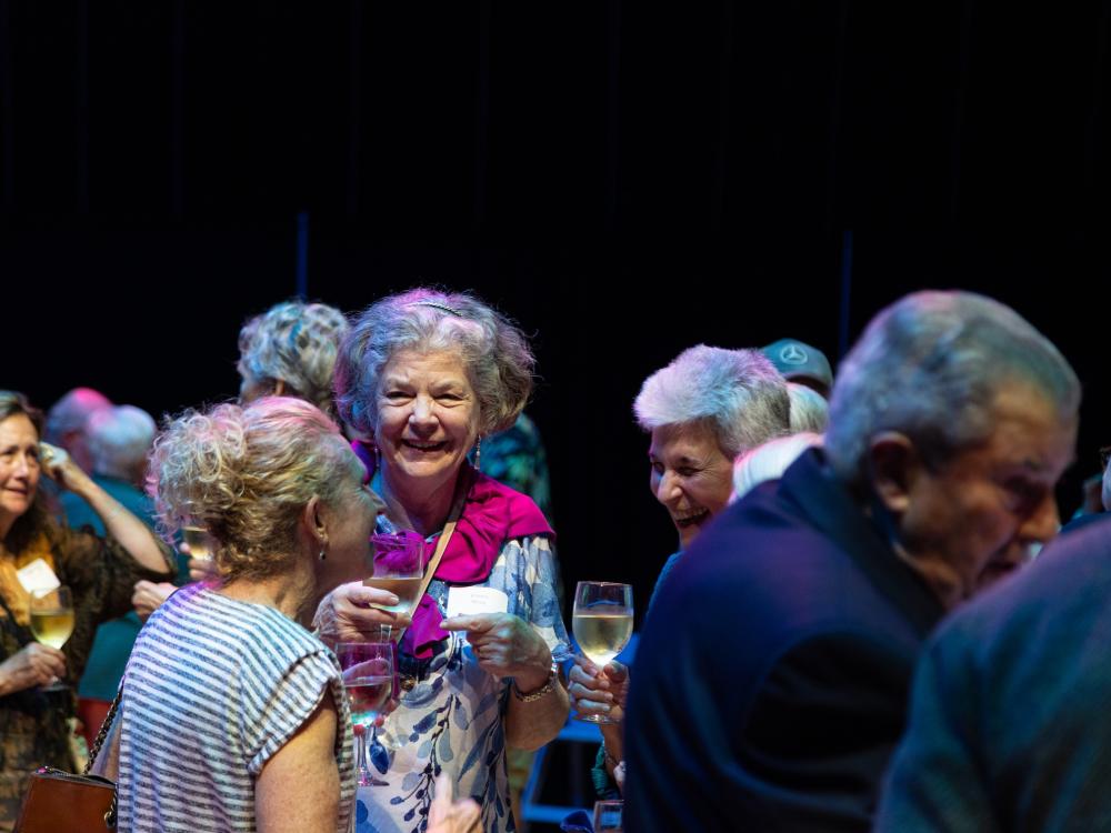 Groups of people talking and mingling