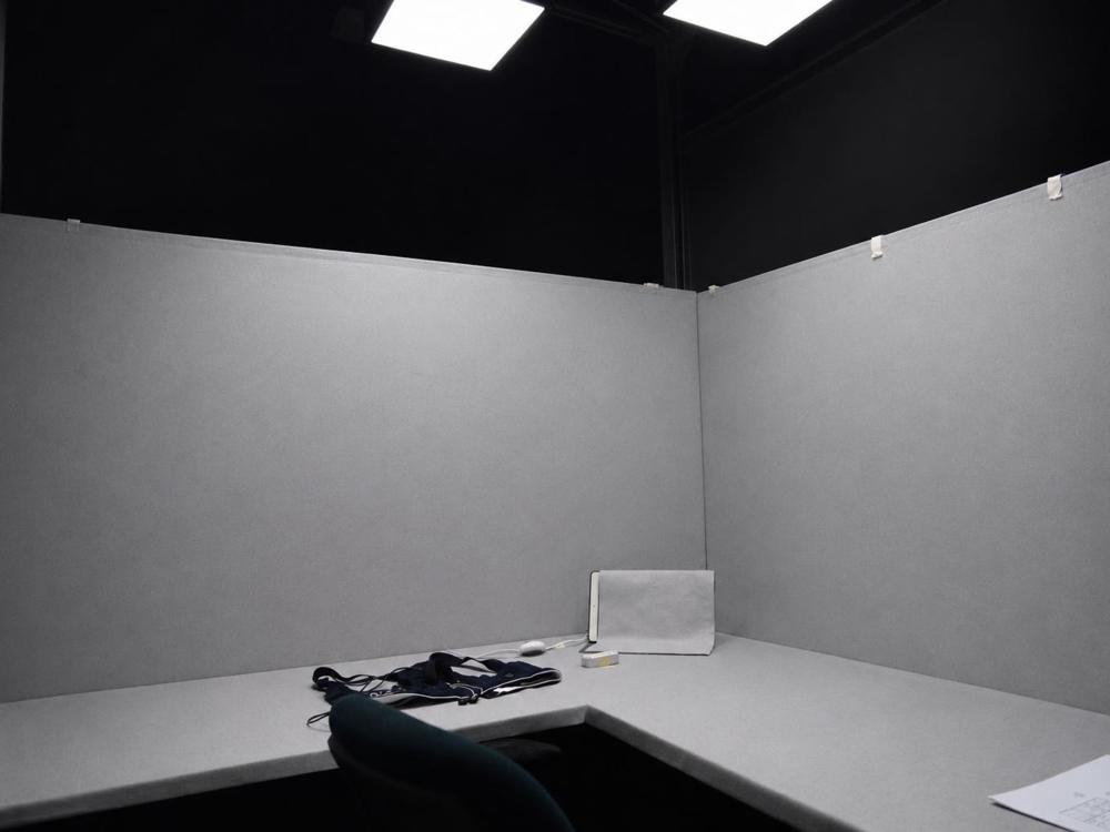 a grey room with lights on
