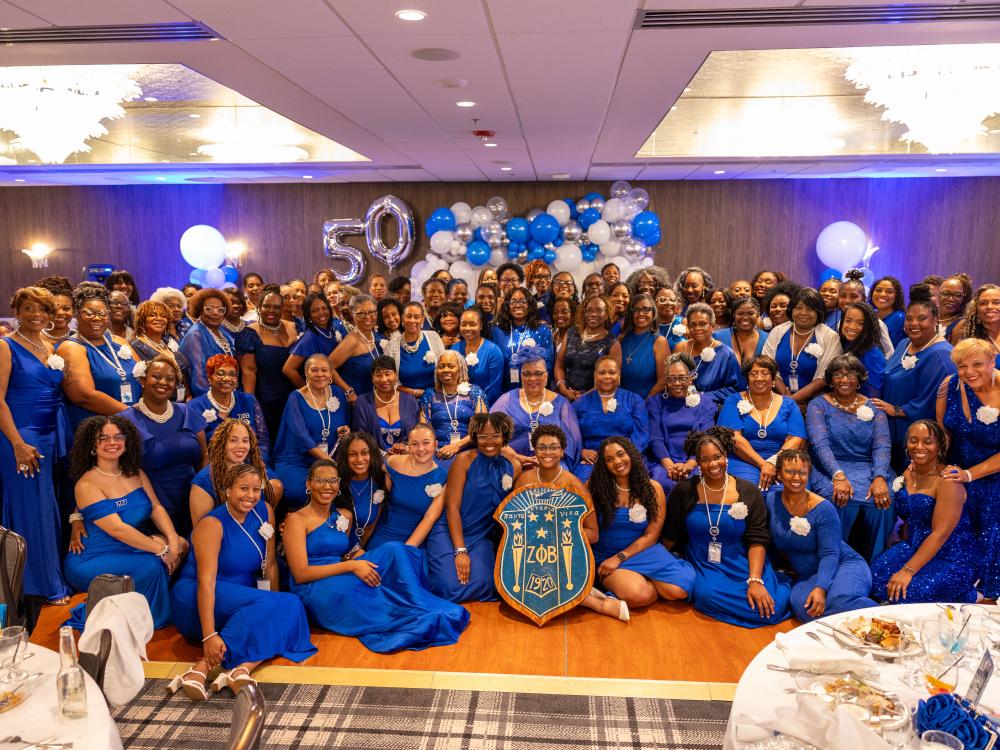 Members of the Mighty Mu Eta chapter gather during a celebration.
