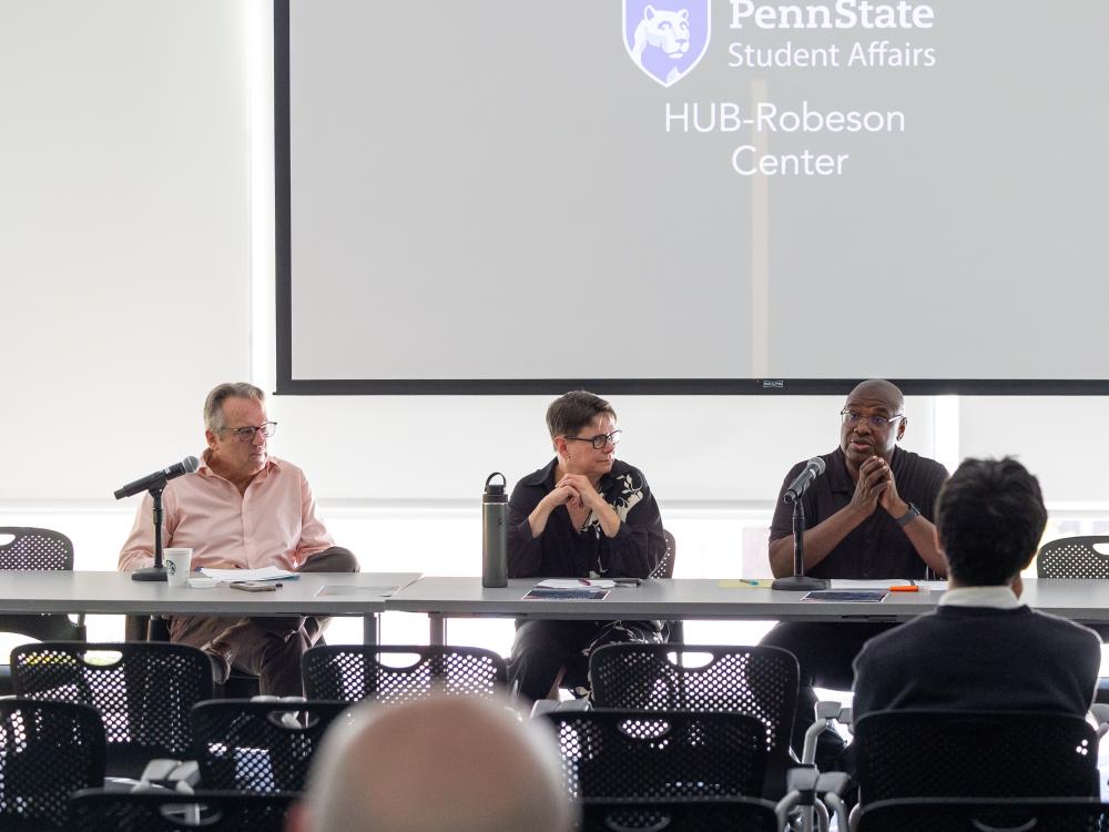 Panelists at the Department of History's America 250 event gather at a table