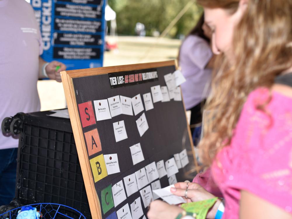 Students interact with a table of resources