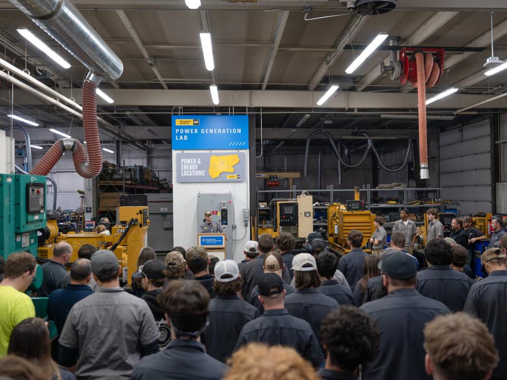 On-site power generation technology student Roman M. Moss, of Stillwater, speaks to onlookers during the dedication of the Cleveland Brothers Cat Power Generation Lab at Pennsylvania College of Technology. 