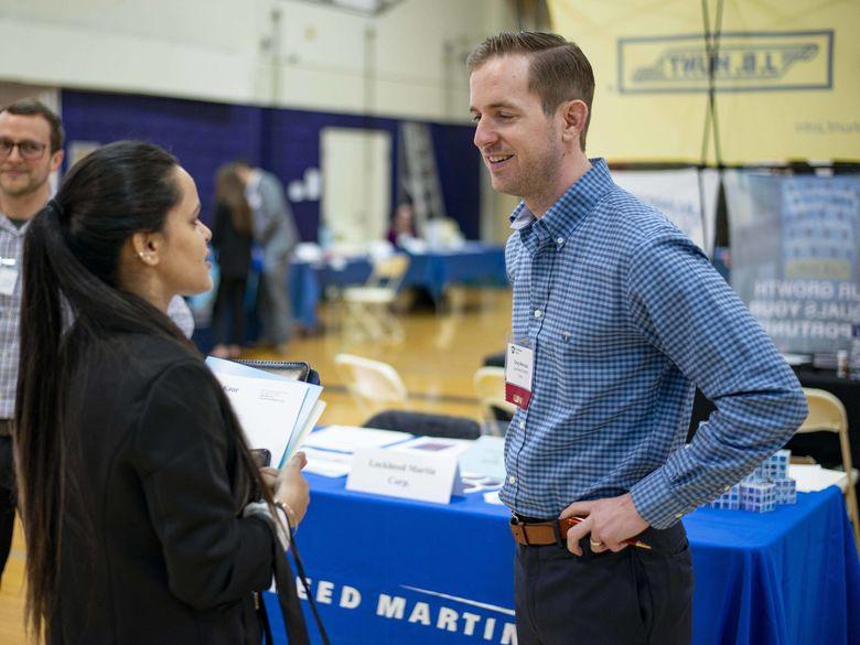 people talking at a career fair