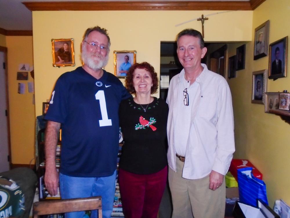 MaryEllen Gray smiles for a photo with her brothers Mike and Tim