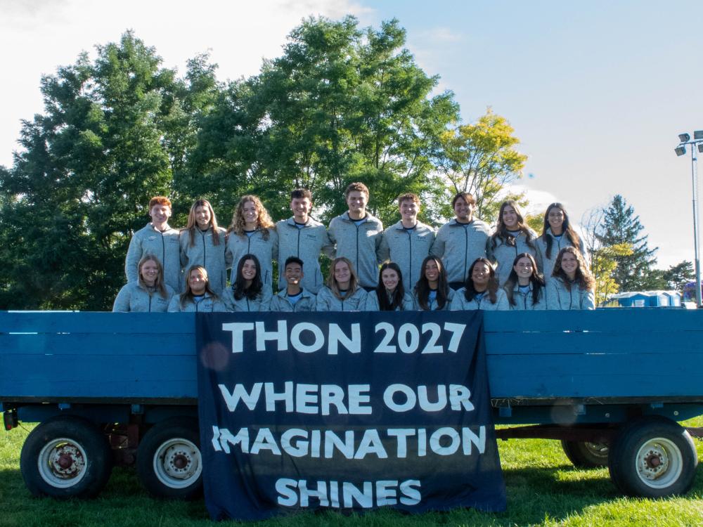THON leadership poses on a float.