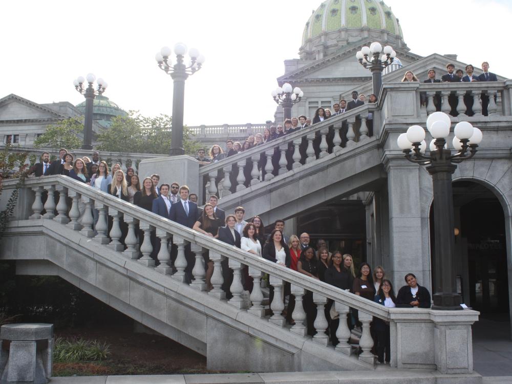 Penn State students pose on the steps of the Pennsylvania Capitol in Harrisburg