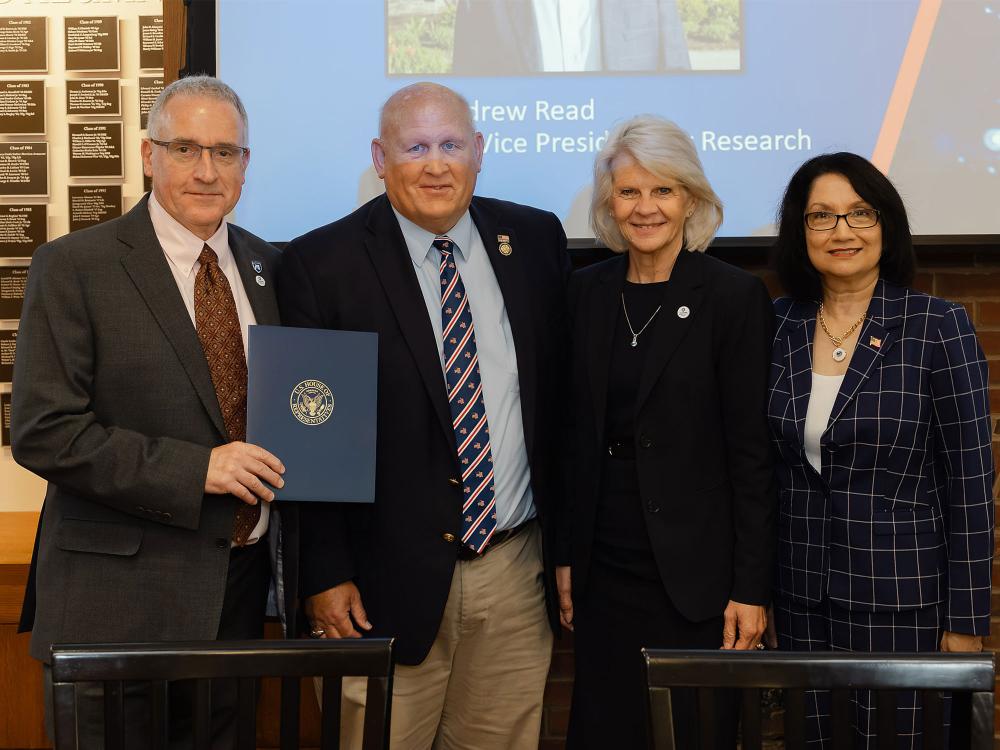Andrew Read, Glenn Thompson, Karen Thole and Neeli Bendapudi pose together for a closeup photo