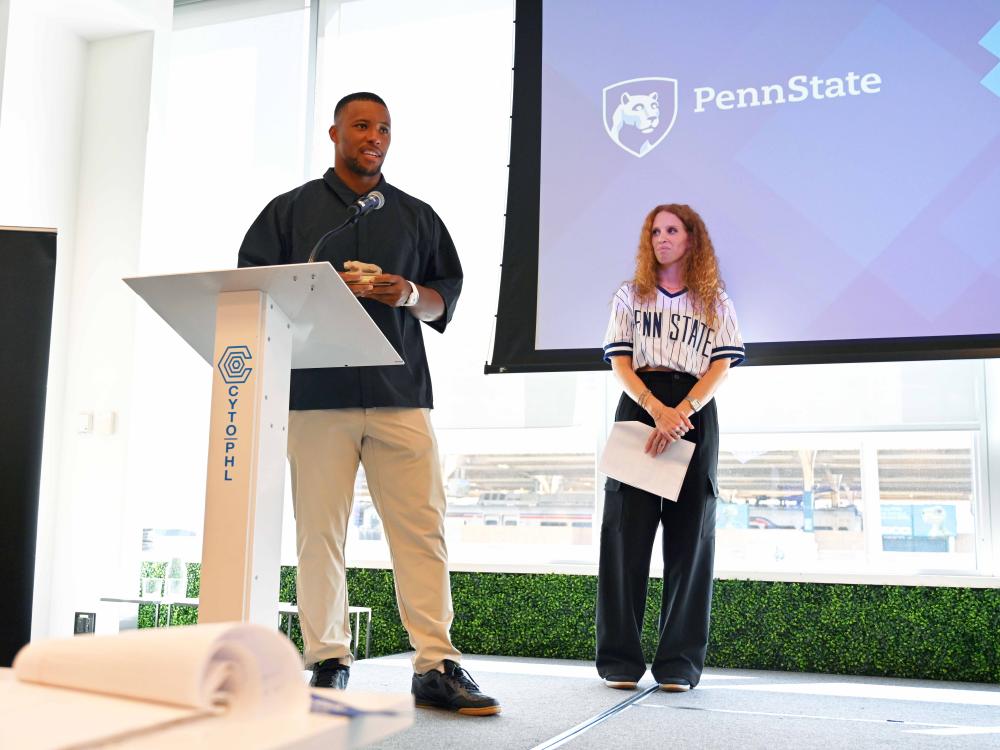 Saquon Barley speaking at a podium.