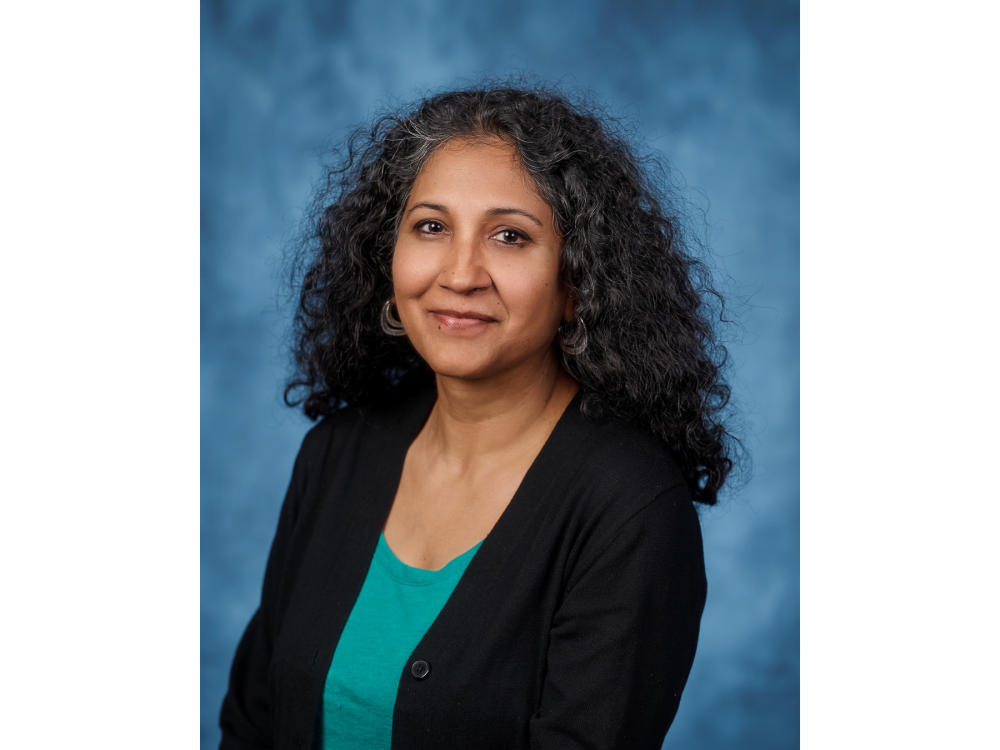 Priya Sharma, associate professor of education and faculty director for AI Literacy and Innovation in the Penn State College of Education, smiles for a headshot.