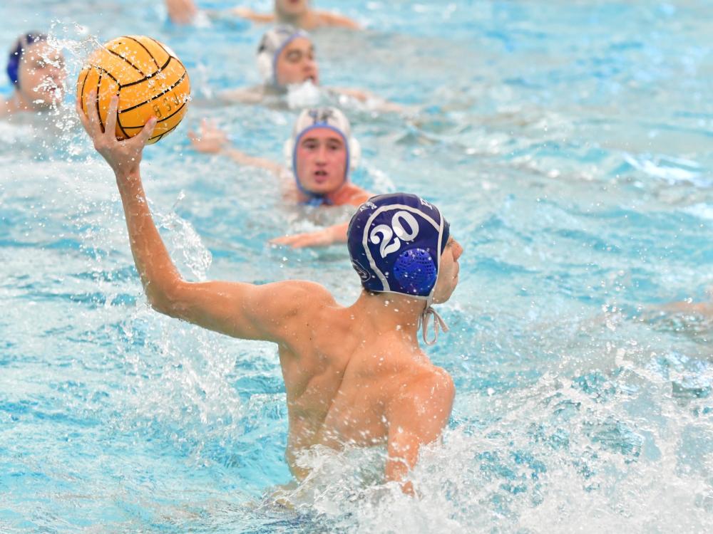 A Penn State Behrend water polo player prepares to throw the ball.