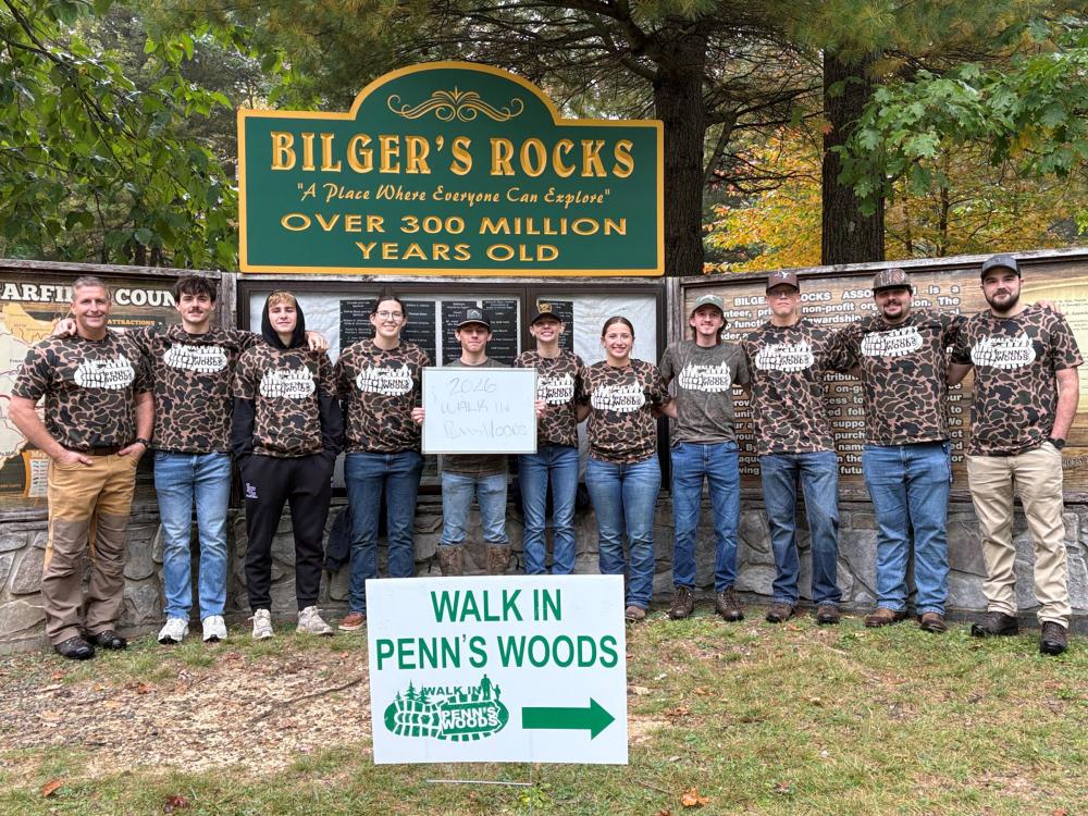 Students in the Wildlife Technology program at Penn State DuBois join assistant teaching professor Mike Eckley for a group photo at the entrance marker of Bilger’s Rocks, an over 300 million-year old rock formation covering more than 20 acres in Clearfield County.