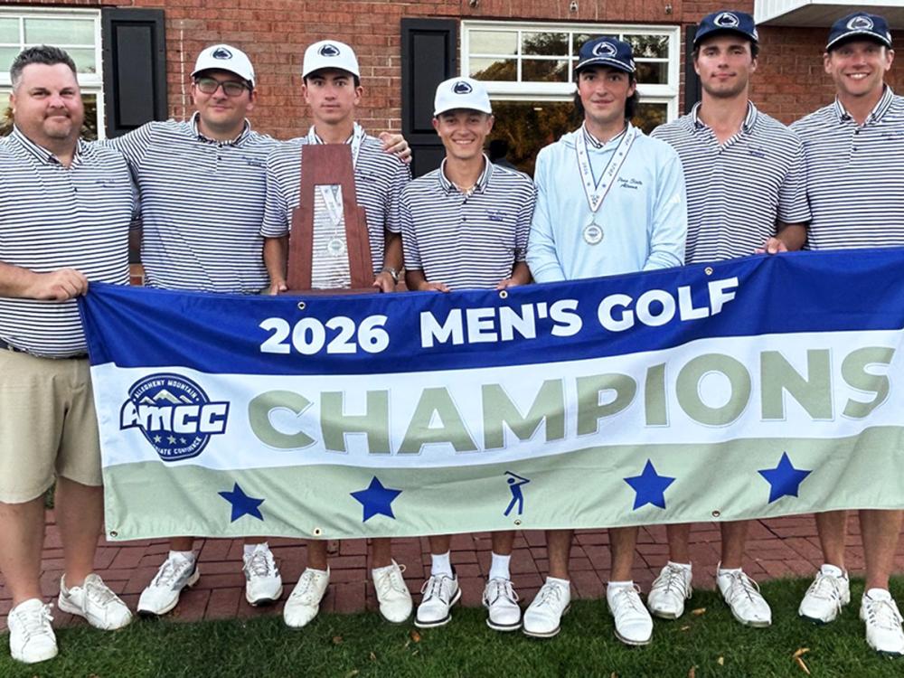 A coach and members of Penn State Altoona's men's golf team post behind a banner announcing them as the 2026 AMCC champions