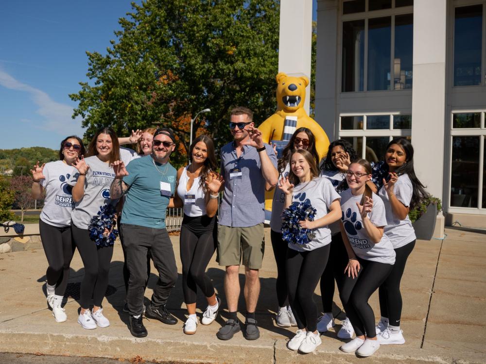 Students and alumni pose outside of Metzgar Center during Penn State Behrend's Families and Alumni Weekend.