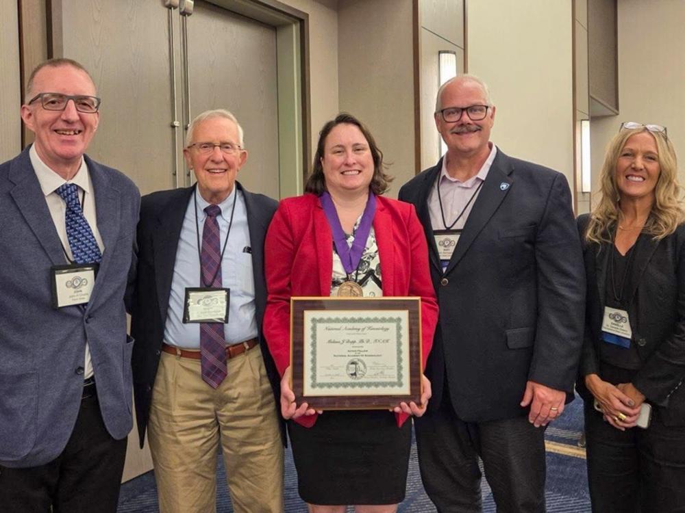 Melissa Bopp (center) is pictured with colleagues