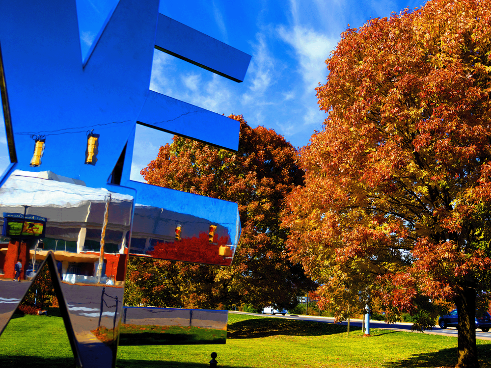 We Are sign at University Park in fall scenery