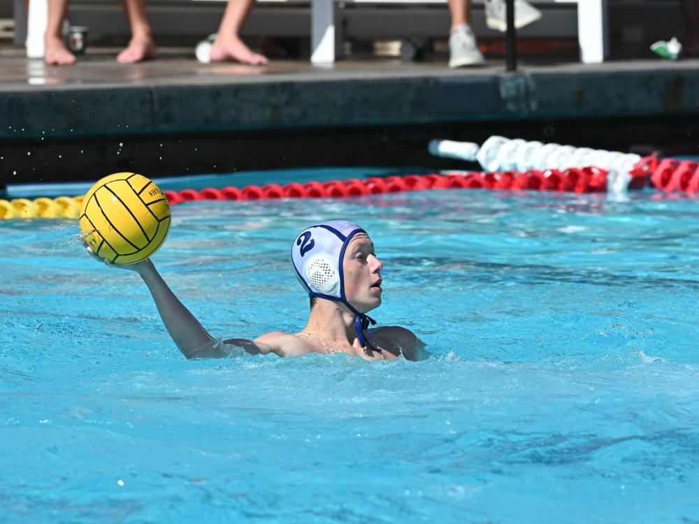 Penn State Behrend water polo player Owen Kroh prepares to throw the ball.