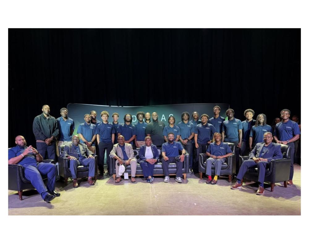 large group of people in navy blue on conference stage
