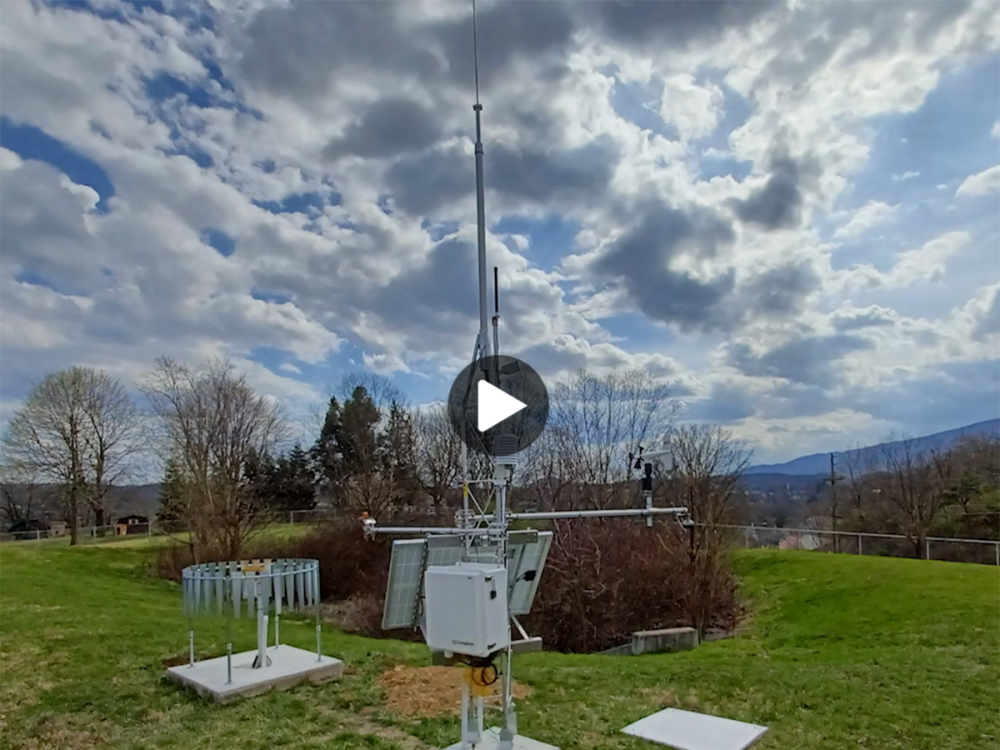 A weather monitoring station on a partly cloudy day 