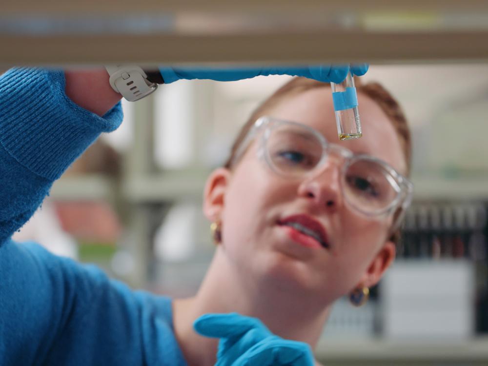 Chemistry graduate student Amanda Gramm examines a sample during her assistantship in the 2025-26 academic year