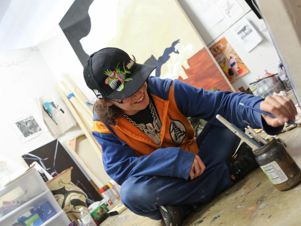 Taylor Bielecki paints in her studio. 