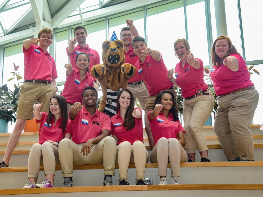 The O Team poses with the Nittany Lion