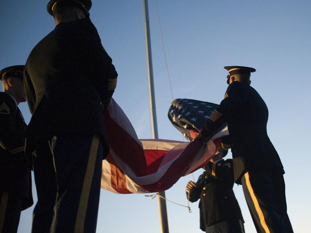 Members of the U.S. Army State College Recruiting Company fold the flag at the start of the 4thFest fireworks celebration.