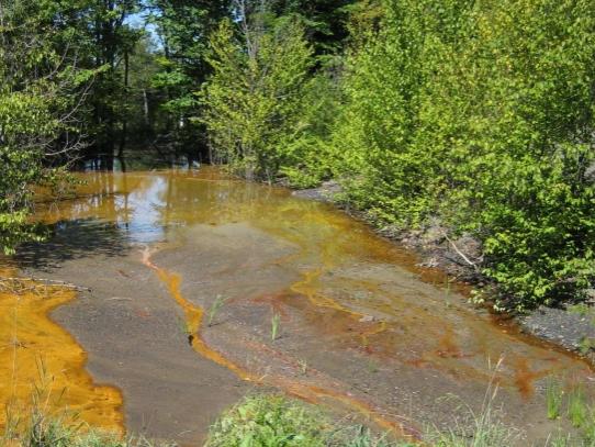 Acid mine drainage turns a stream yellow 
