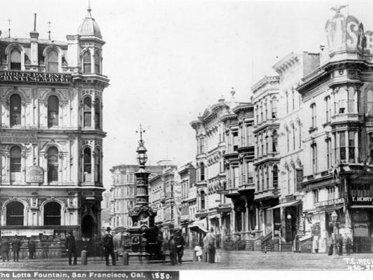 A black and white photograph of Lotta's Fountain in San Francisco in the early 19th century.