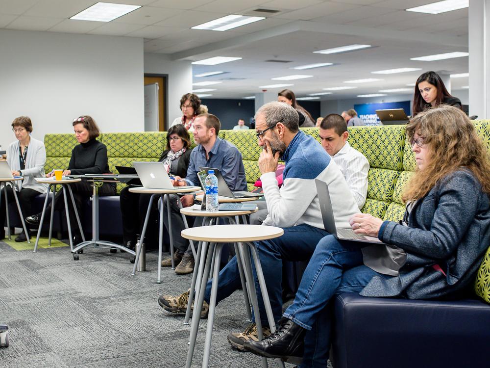 Faculty members gather for a meeting