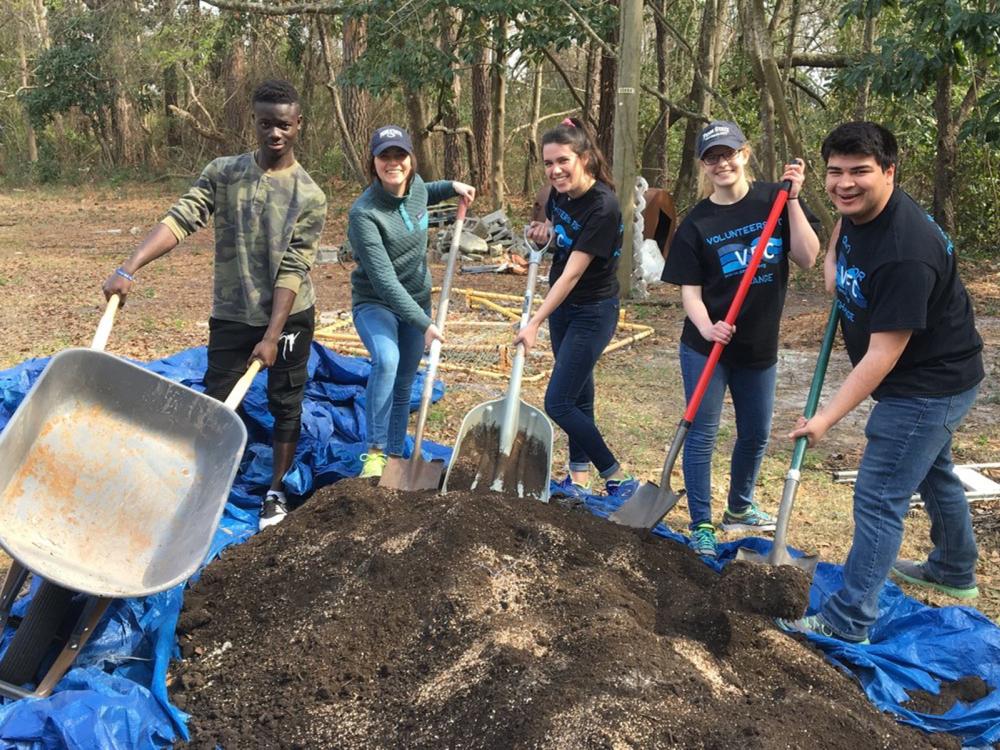 Penn State students dig dirt during an alternative break trip