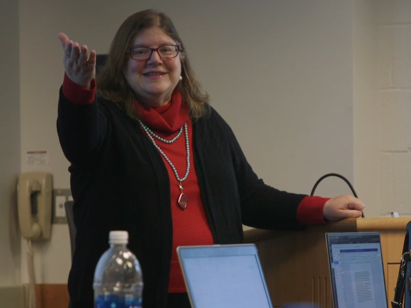 Photograph of Amy Wilson speaking to a class