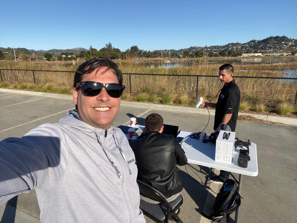 Site of testing drone technology with three males