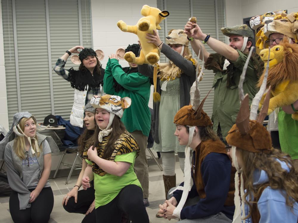 Students performing in costumes