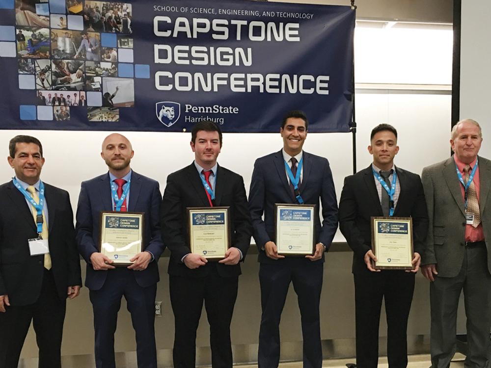 students holding awards