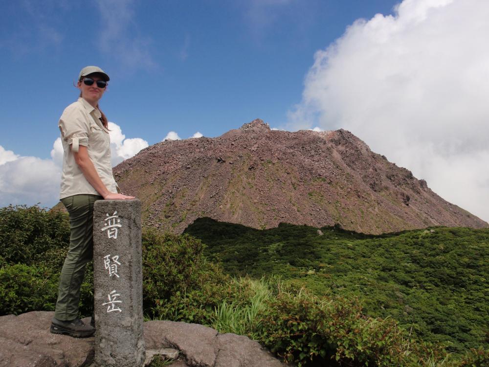 Christelle Wauthier standing in front of a volcano in Hawaii