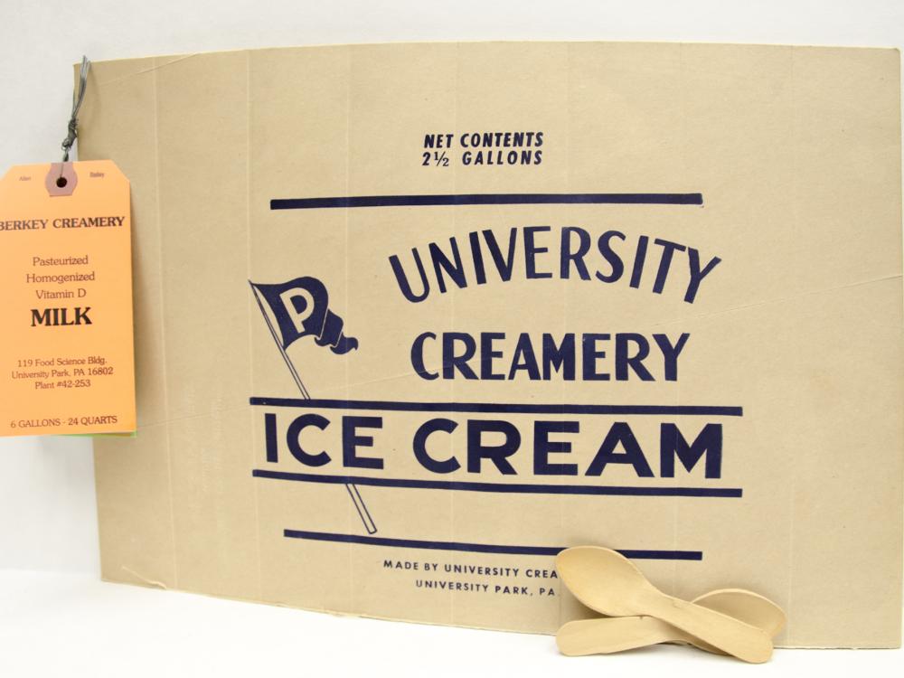 horizonal paper sign with two small wooden spoons and vertical hang tag