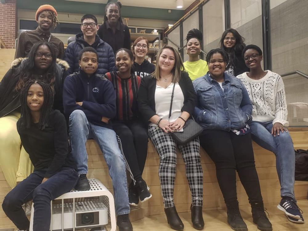 Students stand and sit on stairs of the mezzanine level in Stuckeman Family Building.